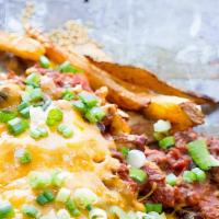 Chili Cheese Fries · Our signature chili, onions and cheese.