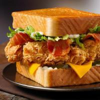 Chicken Club Sandwich · Crispy chicken, bacon, cheddar cheese, lettuce, tomato and mayo on buttered texas toast