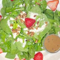 Strawberry Salad · Spinach tossed with a Balsamic Vinaigrette and topped with feta cheese and toasted pecan hal...