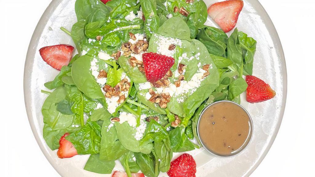 Strawberry Salad · Spinach tossed with a Balsamic Vinaigrette and topped with feta cheese and toasted pecan halves. Top it with sliced grilled chicken breast or salmon for bigger flavor.