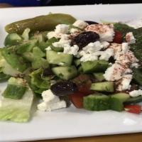 Small Greek Salad · lettuce, tomato, cucumber, onion, feta cheese,
kalamata olives, bell pepper and our house dr...