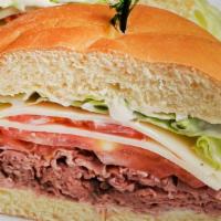 The Midtown Sandwich · Premium roast beef, horseradish sauce, lettuce, tomato and provolone cheese. Served with a c...