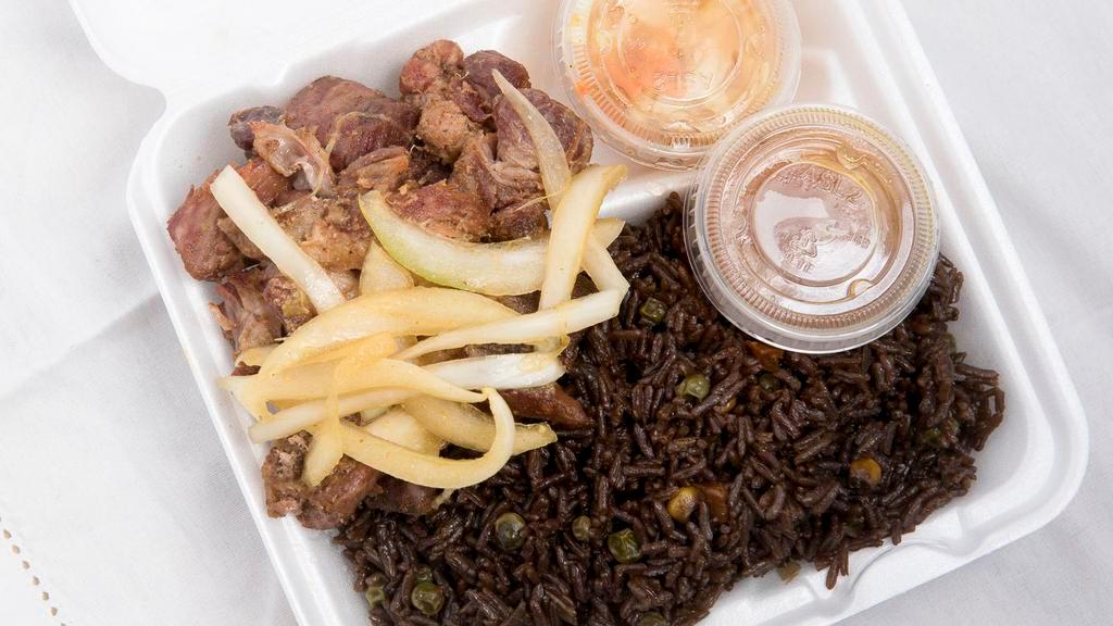 Grio Compl · Fried Pork, Rice, Onions and 
Sauces/pickles
