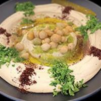Hummus · Blended chickpeas mixed with tahini sauce (sesame sauce), fresh lemon juice and a touch of f...