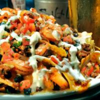 Shrimp & Chorizo Nachos · Contains bacon. Grilled shrimp and chorizo topped with corn, black beans, jack, and cheddar ...