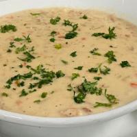New England Clam Chowder · Homemade cream-based chowder served with tender clams and potatoes. (Contains Bacon)