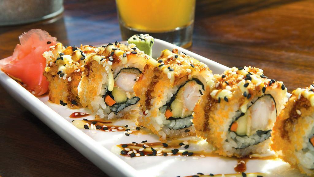 Crunch Roll · Tempura battered shrimp, carrot, cucumber, and cream cheese rolled in a panko breading and flash-fried. Drizzled with eel sauce and wasabi cream.