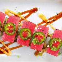 Mexican Shrimp Roll · Tempura battered shrimp and avocado wrapped in soy paper. Topped with sliced ahi tuna, fresh...