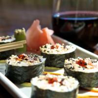 Spicy Tuna Roll · Fresh tuna mix rolled with carrots, cucumber, and cream cheese. Served over wasabi cream and...