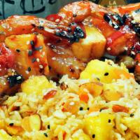 Shrimp Brochette · Large shrimp wrapped in applewood bacon, skewered with pineapples, grilled and glazed with H...