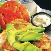 Boca Style Grouper Sandwich · Breaded and pan-sautéed grouper topped with fresh avocado, tomatoes, and lettuce. Finished w...