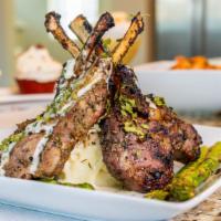 Savory Seared Lamb Chops · Seasoned to perfection and seared Lamb Chops Mounted on a bed of parmesan garlic mashed pota...