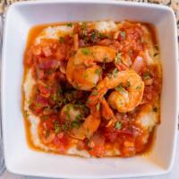 Shrimp And Grits · Sautéed shrimp. Onions, bell peppers. In creole styled sauce, Served over Creamy white chedd...