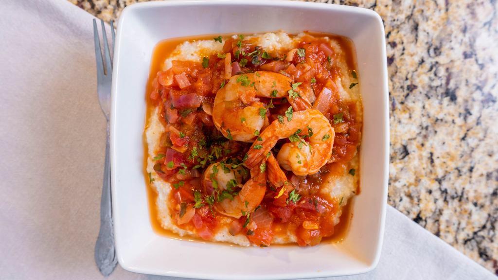 Shrimp And Grits · Sautéed shrimp. Onions, bell peppers. In creole styled sauce, Served over Creamy white cheddar grits.