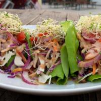 Asian Lettuce Wrap · Glute free. Vegan. Contains sesame, tree nuts. Shiitake mushrooms, seasoned & marinated in a...