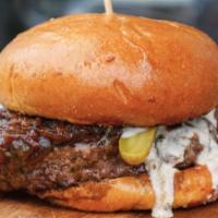 Le Steakhouse Burger · Gluten free. Maitre d' butter, caramelized onions, horseradish aioli, cornichons.
