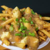 Poutine · Fries covered with Wainright Dairy Fresh Cheese Curds, Housemade Gravy, Scallions.