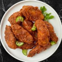 Native Nashville Hot Wings · Fresh chicken wings fried until golden brown and tossed in Nashville Hot Sauce. Served with ...