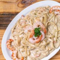 Shrimp Alfredo Pasta · Our famous home-made alfredo sauce tossed in with fresh spaghetti and topped with shrimp. Se...