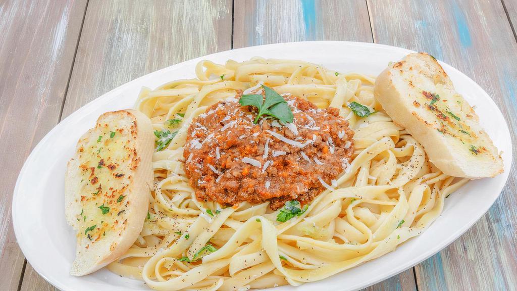 Spaghetti Bolognese · Spaghetti with fresh, made to order, bolognese sauce. Served with garlic bread.