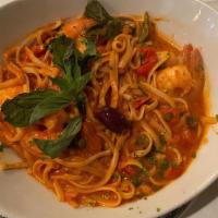 Linguine Ai Gamberi · Shrimps sautéed with fresh herbs, garlic, olive oil, capers, black olives, roasted peppers t...