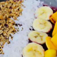 Acailandia · Base of the bowl with strawberry pineapple banana apple juice and acai. on top of granola co...