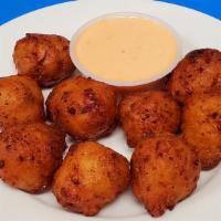 Conch Fritters  · Eight pieces.
