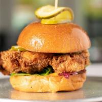 Og Chicken Sandwich · fried chicken served on a brioche bun, with greens, tomato, pickles and bang sauce.