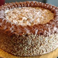 German Chocolate Cake · Dark chocolate layers baked with chocolate chunks, filled with our own German chocolate cust...