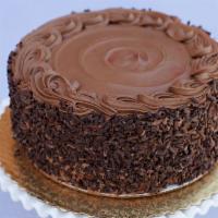 Old Fashion Chocolate Layer Cake · Dark chocolate layers baked with Callebaut chocolate chunks, filled and decorated with our c...