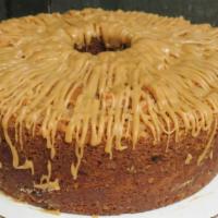 Apple Spice Pound Cake · Fresh grated granny smith apples, toasted walnuts and plump raisins in a moist spice cake. T...