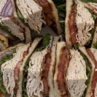 Turkey Club · Fresh cut homemade turkey off-the-bone, loaded with bacon, lettuce and tomato.