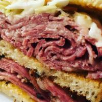 Hot Pastrami Rachel · Tender pastrami, topped with sauerkraut and melted swiss cheese. Served on grilled rye bread.