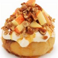 Caramel Apple Pie Roll · Caramel  frosting topped with fresh apples, pie crumble, pecans and caramel sauce.
