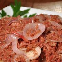 Corn Beef · Cooked down in onions, tomatoes, bell peppers over a bed of white rice or three fried dumpli...