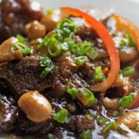 Oxtail · Cooked in a mouth watering brown sauce with butter beans and served with your choice of whit...