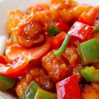 Sweet & Sour Chicken · Bell peppers, pineapple, onions all swimming and this homemade sweet and sour sauce over a b...