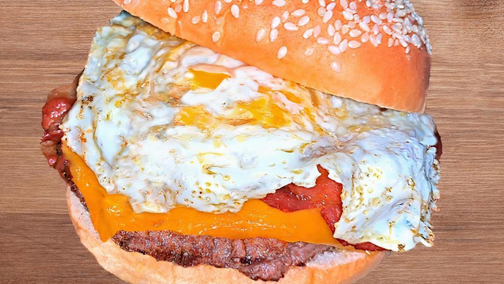 Sunrise Burger · Beef patty, bacon, fried egg, cheddar.
