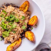 Cuban Bowl · Pulled pork, rice, black beans, plantains, mojo sauce and cilantro.