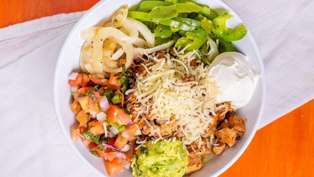 Fajita Salad · Grilled peppers and onions, shredded cheese, pico de gallo, guacamole, sour cream and your choice of dressing.