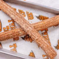 Churro · Fried golden and topped with cinnamon and sugar.