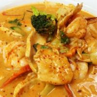 Panang Curry · classic Thai panang curry, made with coconut cream, bell peppers, herbs , & spices
