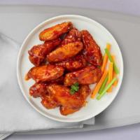 Buffalo Heat Wings · Fresh chicken wings breaded, fried until golden brown, and tossed in buffalo sauce. Served w...