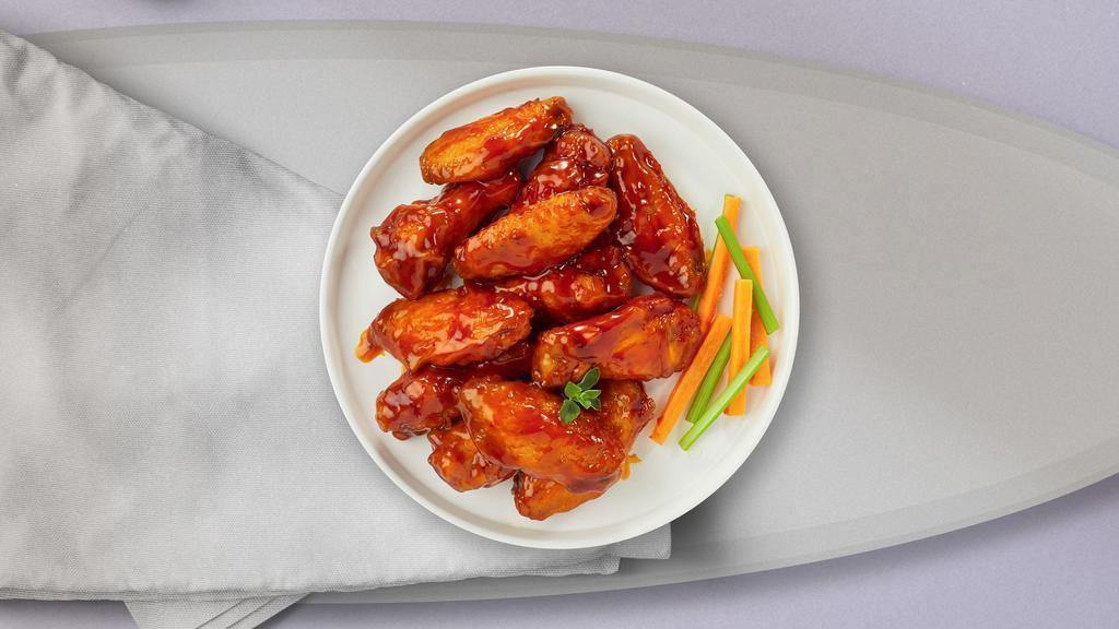 Buffalo Heat Wings · Fresh chicken wings breaded, fried until golden brown, and tossed in buffalo sauce. Served with a side of ranch or bleu cheese.