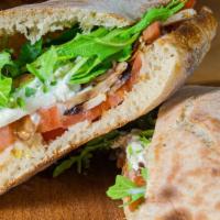 Vegetarian Sandwich · Arugula, cherry tomatoes, burrata, mushrooms and olives