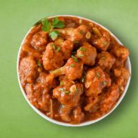 Cauli Manchurian · Fried cauliflower florets sauteed with onions, ginger, garlic, bell peppers and tossed in a ...