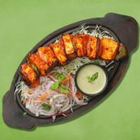 Cottage Cheese Tikka · Homemade cottage cheese cubes marinated in yogurt and spices cooked in clay oven with bell p...