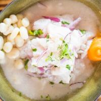 Tradicional Ceviche · Marinated lightly in lime juice and seasoned with Peruvian limo chili, fresh cilantro, and o...
