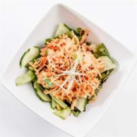 Crab Salad Crunch · Crab salad, cucumber, seaweed salad, tempura flakes, spring mix, eel sauce and spicy mayo.