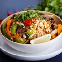 Pad Thai · Thin, bouncy rice noodles stir-fried with scrambled eggs, crunchy bean sprouts, scallions, g...